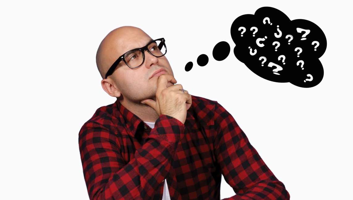 pondering man with thought bubble of question marks