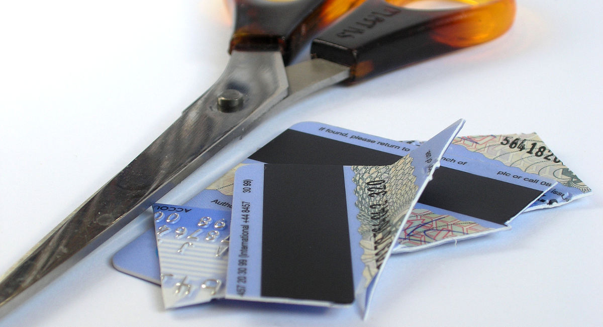 cut up credit card next to scissors