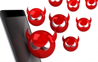 devil emojis rising from mobile phone