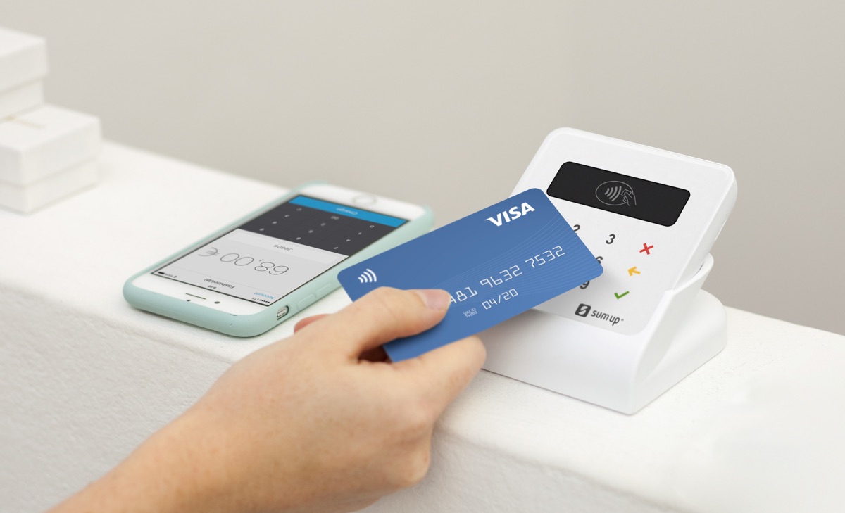Debit card tap on SumUp Air on countertop