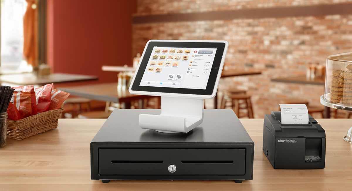 Square Stand on cash drawer on wooden countertop