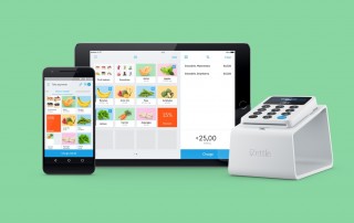iZettle Reader on Dock with app on iPhone and iPad