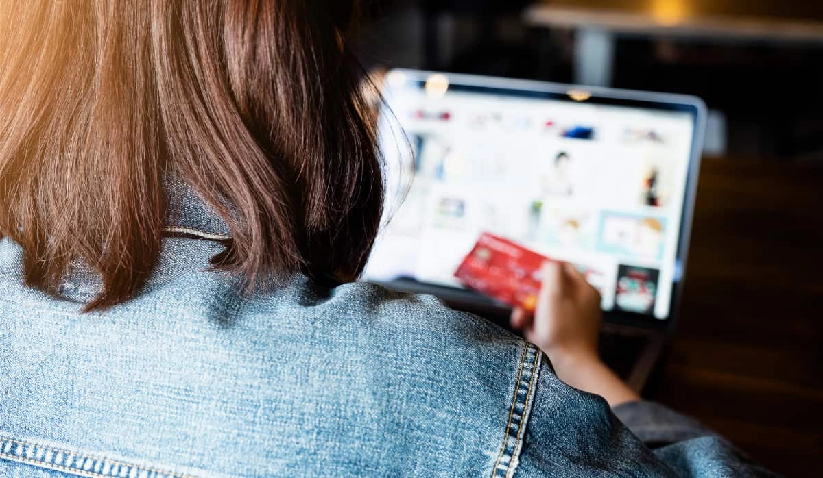 girl from behind paying online by card