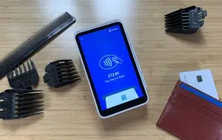 Square Terminal among hairdressing tools and wallet
