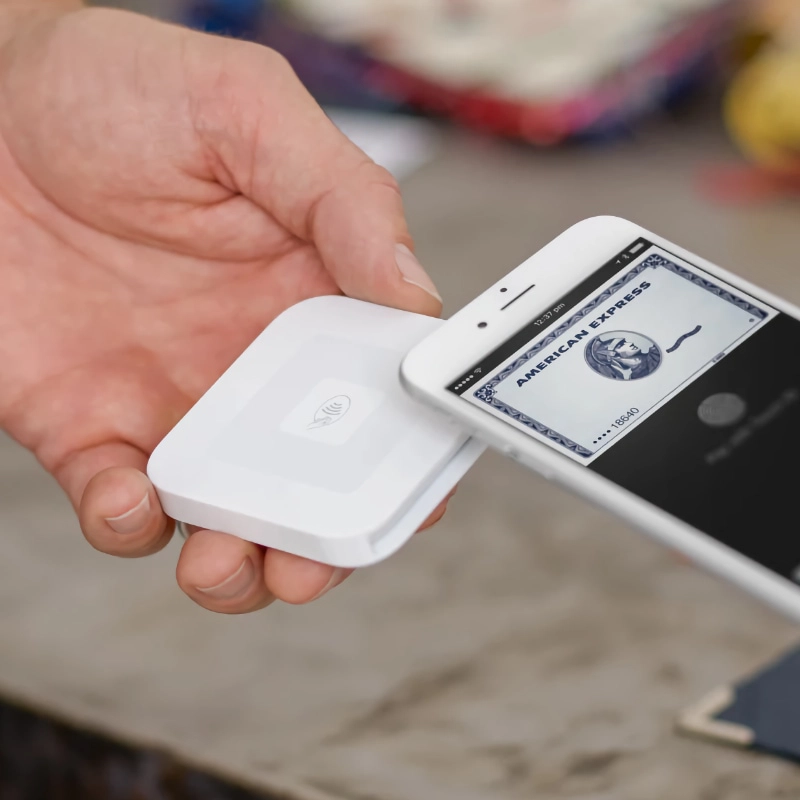 Customer paying with Apple Pay on Square Reader