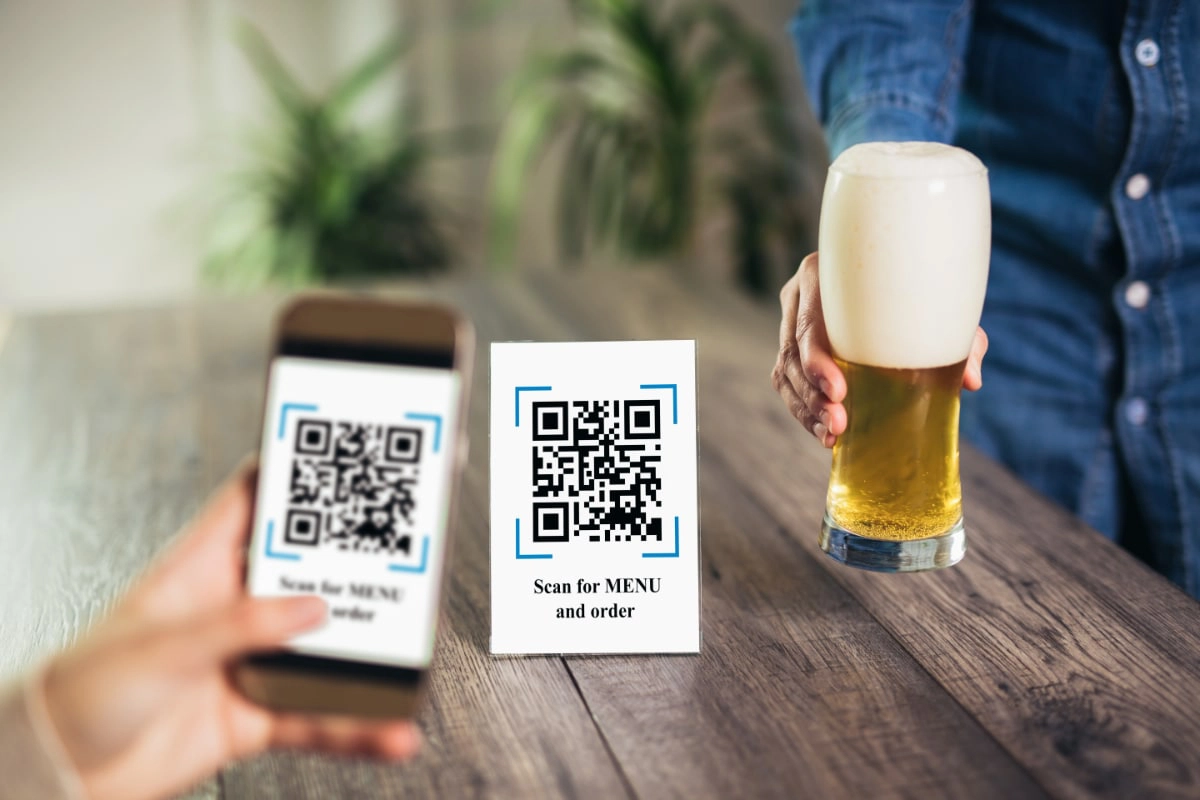 smartphone scanning QR code to view drinks menu