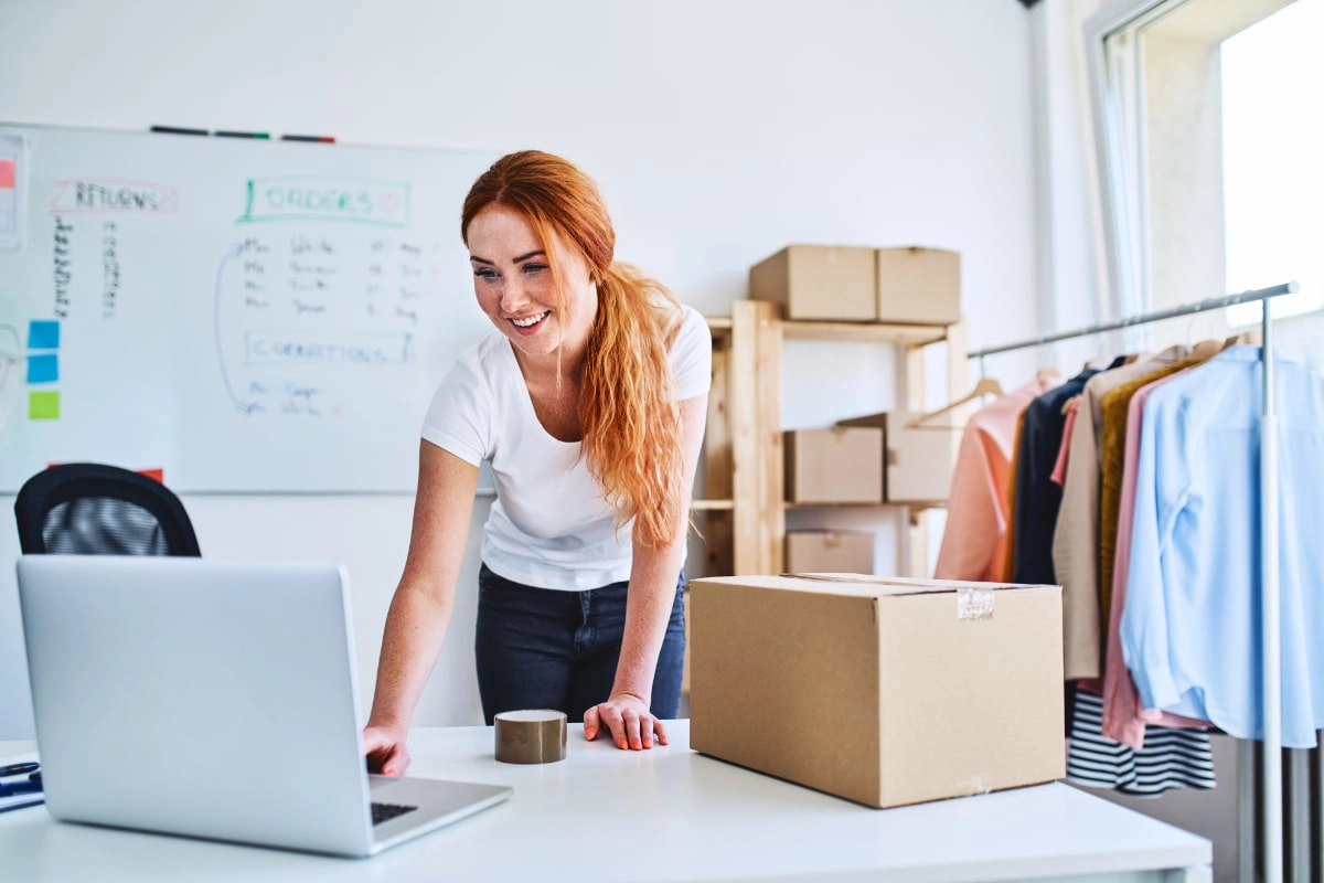 woman packing an order for shipping