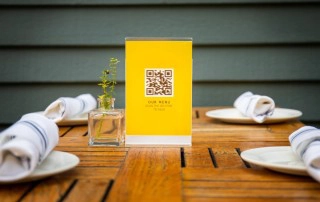 QR code menu sign on restaurant table