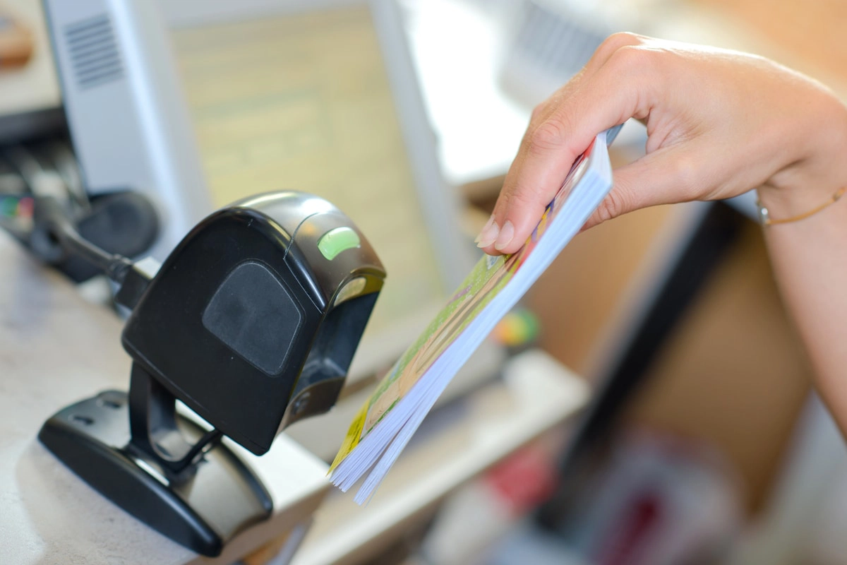 stationary barcode scanner being presented with a barcode