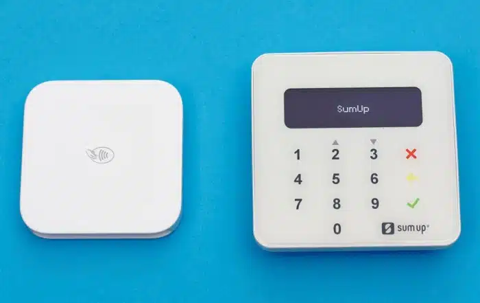 Square and SumUp card readers on blue background