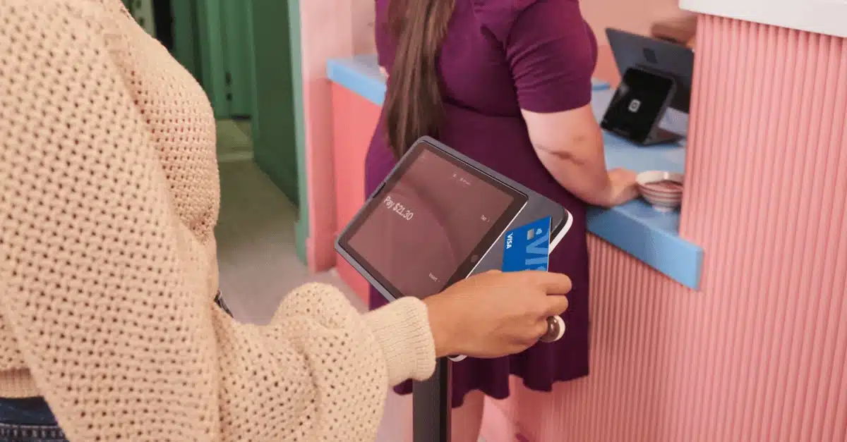 Customer paying at Square Kiosk