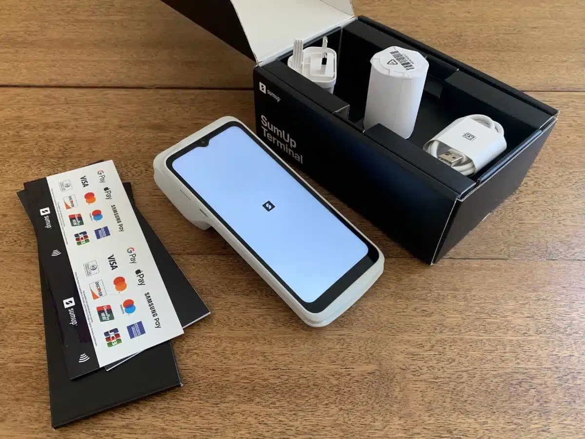 Our SumUp Terminal box arrived complete with paper rolls, cable and an adaptor SumUp Terminal box contents including decals, receipt roll, adaptor and cable