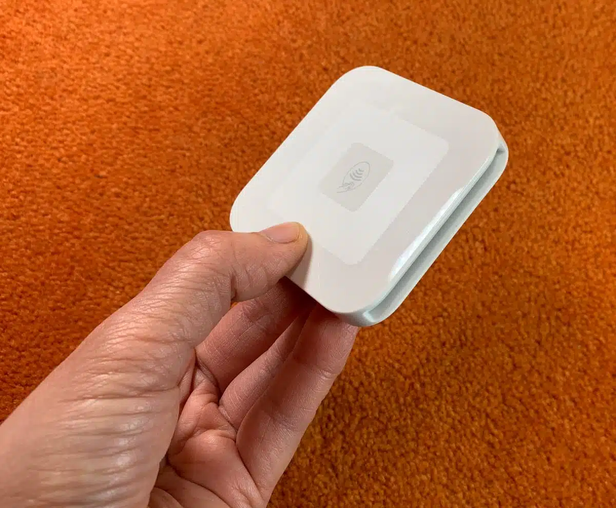Square Reader is one of the smallest card readers we’ve tested Square Reader held in our editor's hand