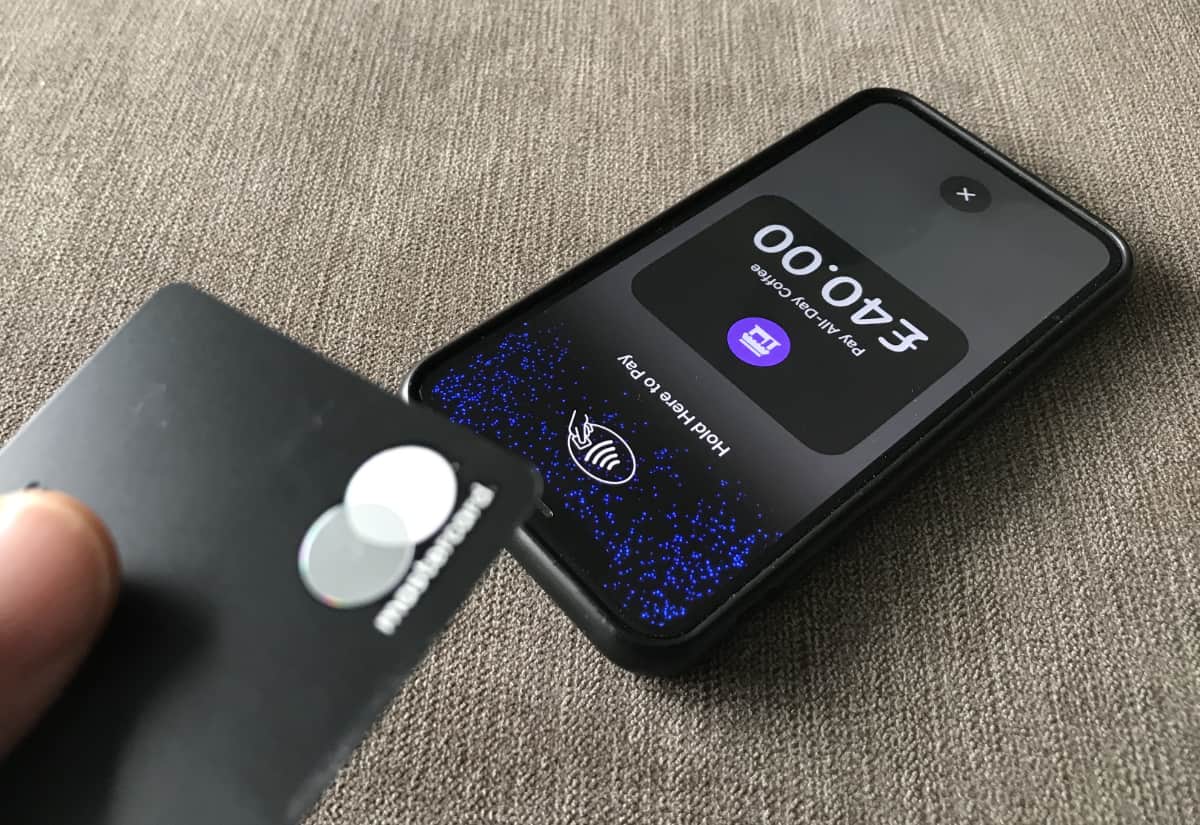 Tap to Pay on iPhone works smoothly for us, as long as there’s a stable internet connection A Mastercard held above an iPhone for a Tap to Pay transaction