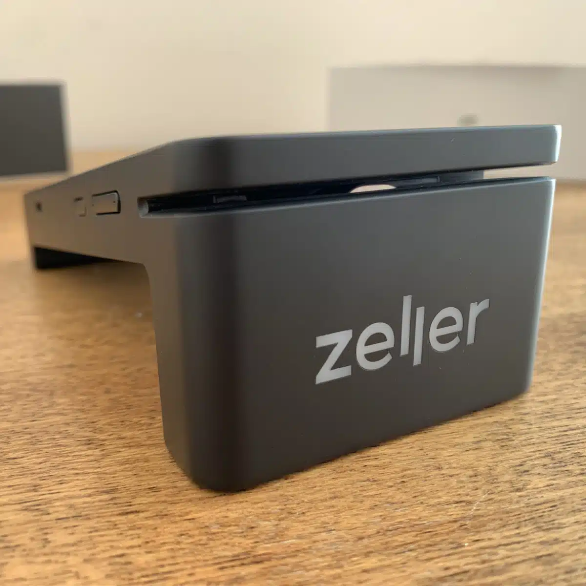 Above Zeller Terminal 2’s front side logo is a swipe card slot Zeller Terminal 2 has a lit-up logo on the front side